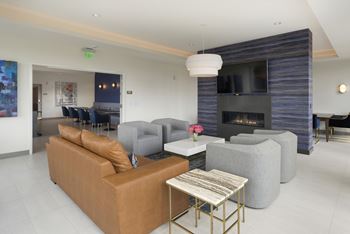 A living room with a fireplace and a couch.